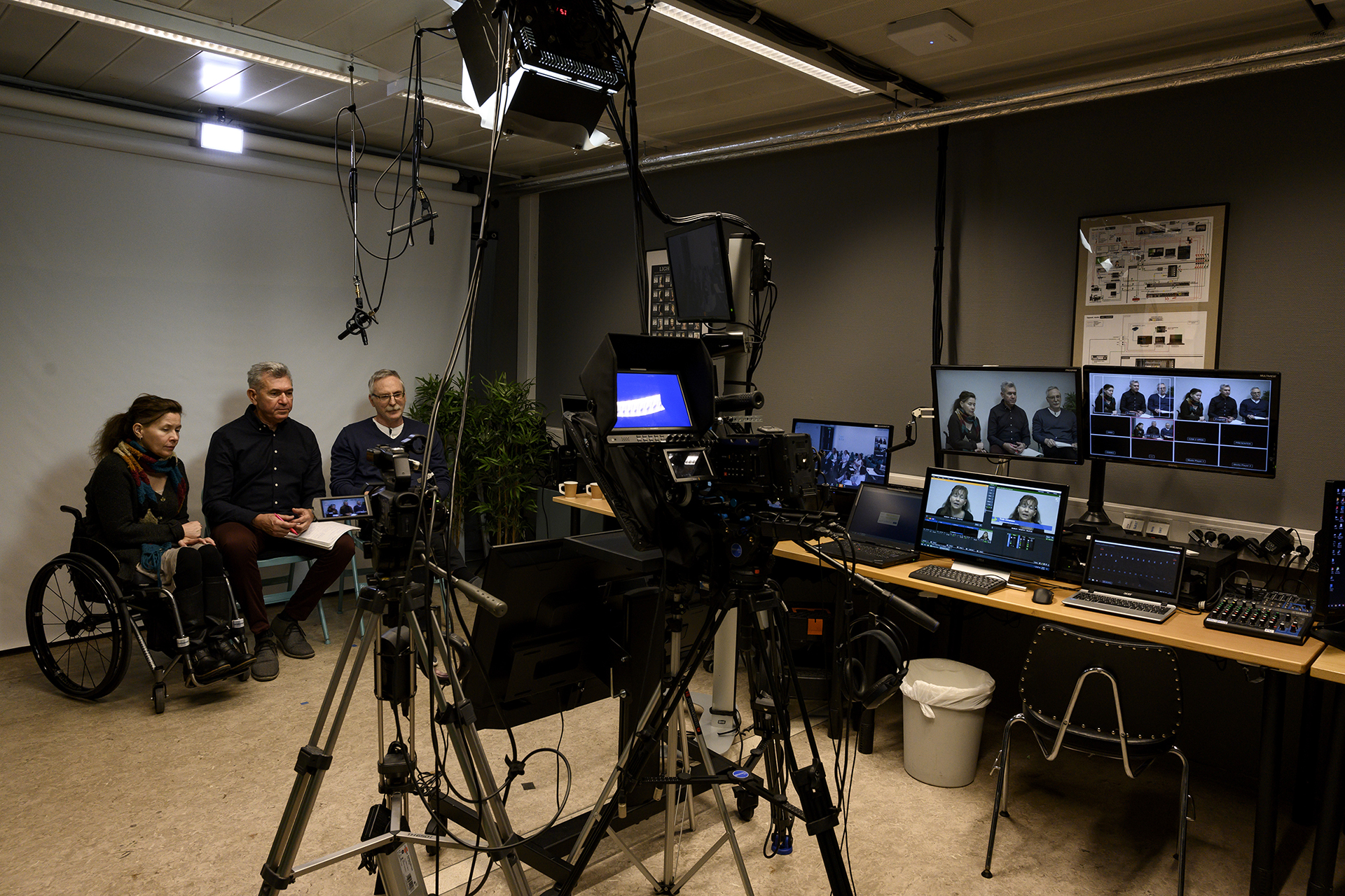 Studio with people filming a video