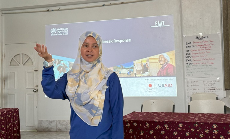 Mazniza Mustaffa shares her experiences on Outbreak Response in a classroom session